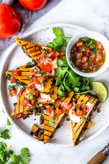 Farmers Market Veggie Quesadillas with black beans and farmer's market veggies like bell peppers, zucchini, sweet potato, greens, and melty cheese (optional) seasoned with Mexican spices. Vegan-adaptable and Gluten-free adaptable!