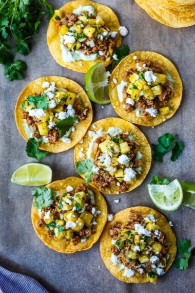 chipotle tostadas脆脆，新鲜且易于制作。 A crispy homemade tostada shell piled with savory ground turkey (or meat of your choice!), avocado cream and fresh pineapple salsa.  So good and so easy!